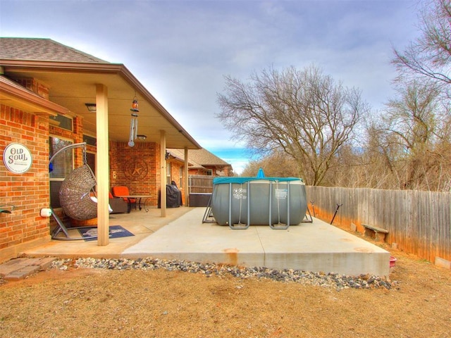 view of patio / terrace with a fenced in pool and a fenced backyard