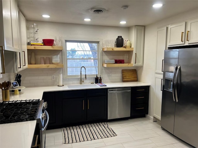 kitchen with open shelves, a sink, light countertops, dishwasher, and black refrigerator with ice dispenser