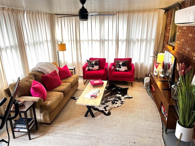 living area featuring a ceiling fan and a wall mounted air conditioner