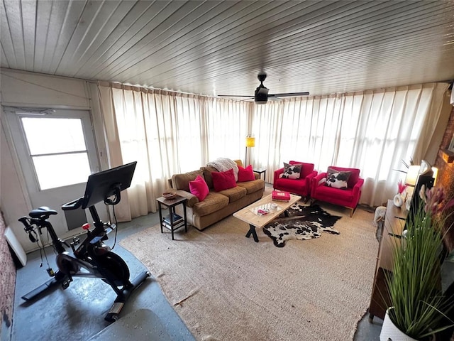 living room with a wealth of natural light and ceiling fan