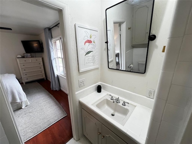 bathroom featuring vanity and wood finished floors