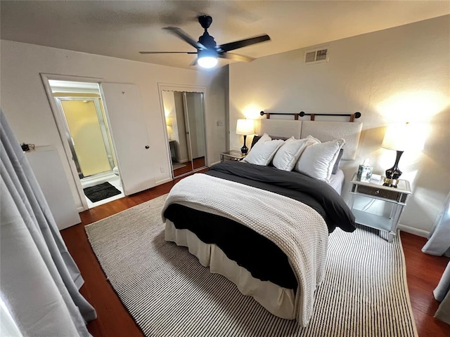 bedroom with a ceiling fan, wood finished floors, visible vents, and baseboards