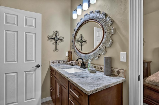 bathroom with ensuite bathroom and vanity