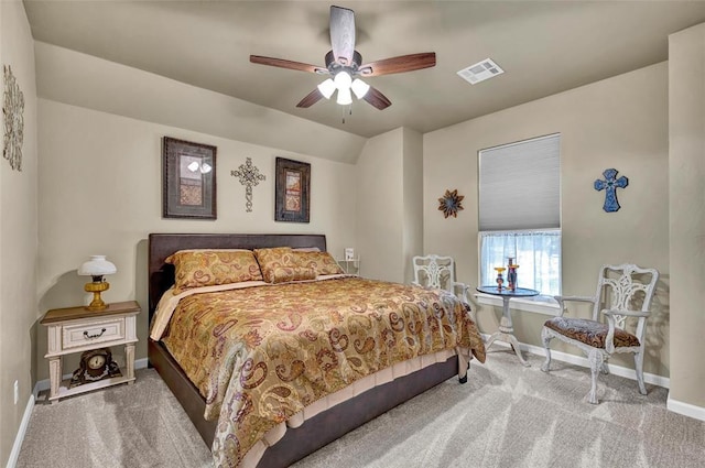 carpeted bedroom featuring visible vents, baseboards, and ceiling fan