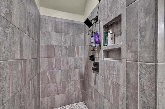 bathroom with tiled shower