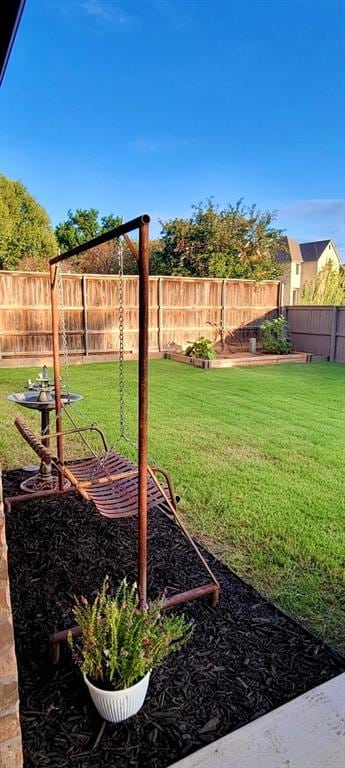 view of yard with a fenced backyard