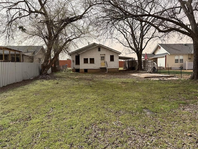 view of yard with entry steps and fence