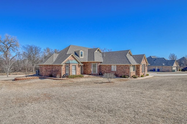 view of front of property featuring brick siding