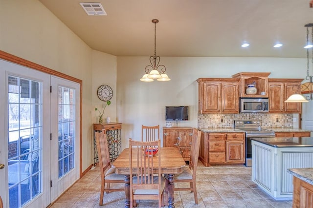 dining room featuring light tile patterned floors, visible vents, recessed lighting, and an inviting chandelier