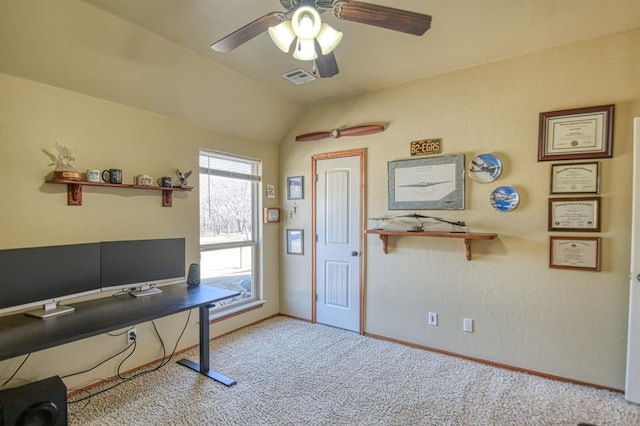 office space with visible vents, lofted ceiling, a ceiling fan, carpet floors, and baseboards