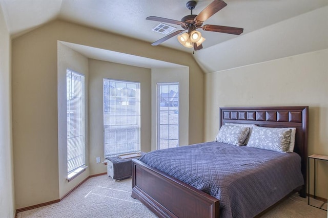 bedroom featuring baseboards, light colored carpet, ceiling fan, and vaulted ceiling