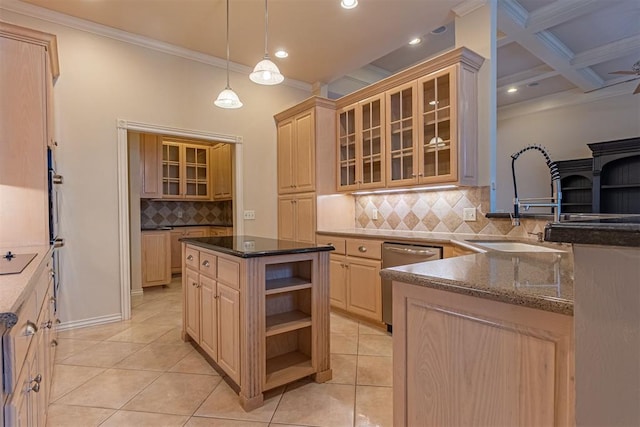 kitchen featuring light brown cabinets, ornamental molding, dark stone countertops, stainless steel dishwasher, and a sink