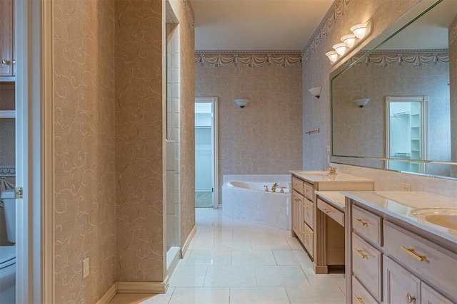 full bath featuring tile patterned flooring, a sink, a garden tub, and double vanity