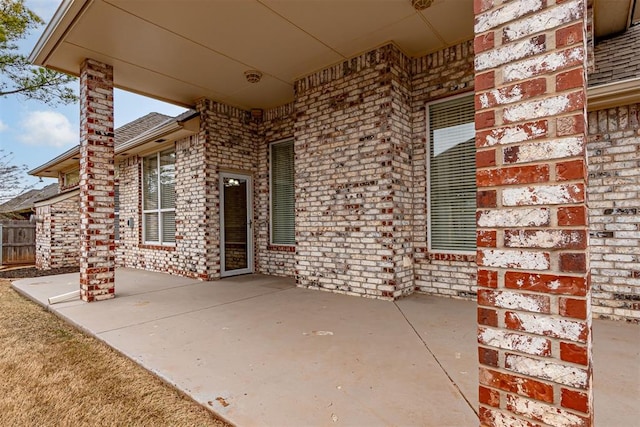 view of patio / terrace featuring fence