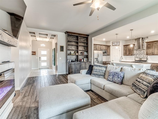 living area with ceiling fan, baseboards, dark wood finished floors, and recessed lighting