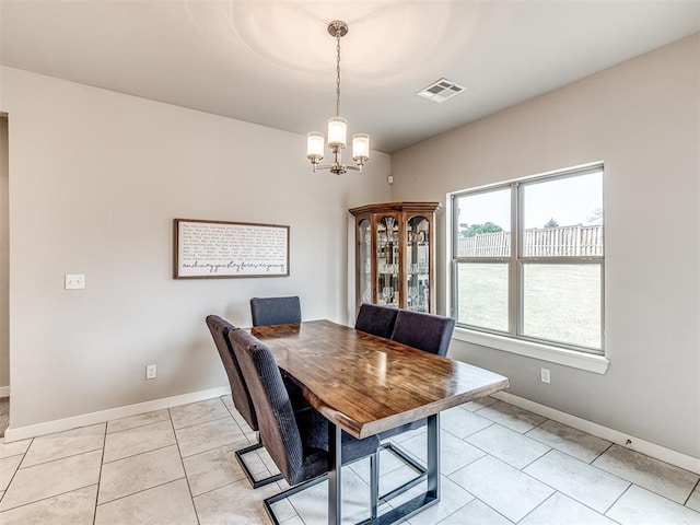 dining space featuring visible vents, baseboards, an inviting chandelier, and light tile patterned flooring