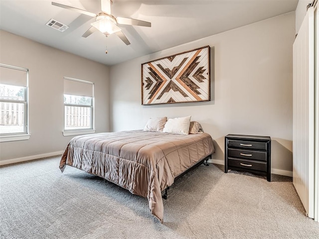 bedroom featuring carpet flooring, baseboards, and visible vents