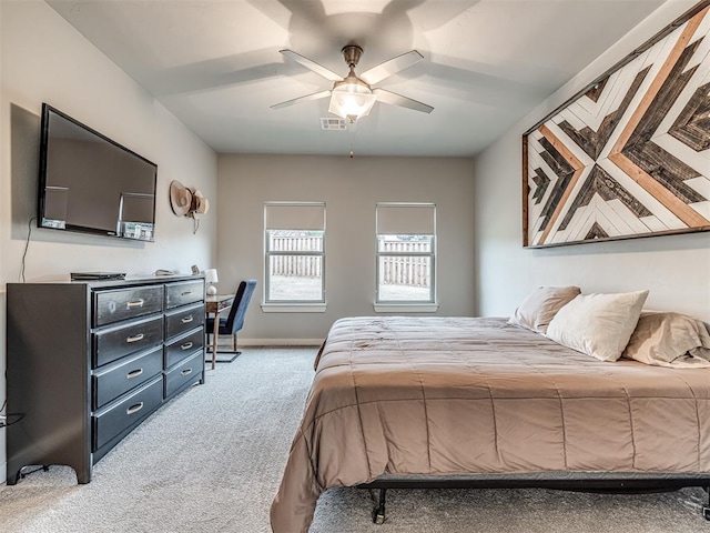 bedroom featuring visible vents, baseboards, ceiling fan, and carpet floors