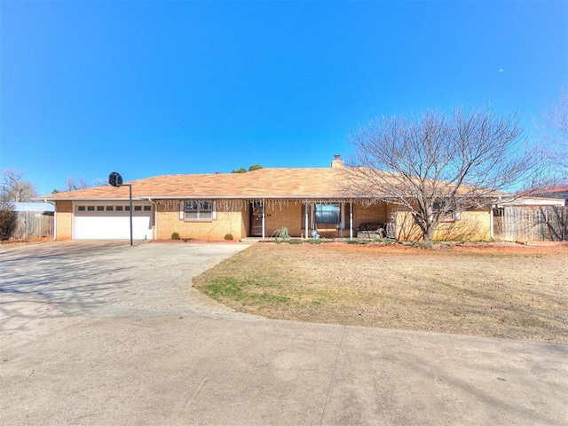 single story home with fence, a garage, driveway, and a chimney