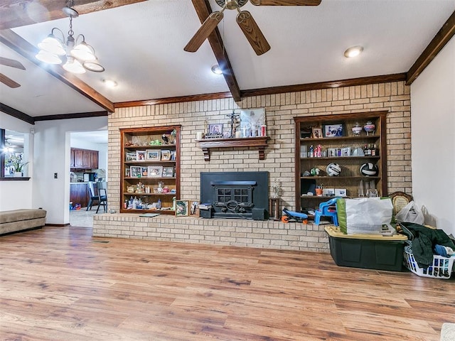 living area featuring wood finished floors, beamed ceiling, built in shelves, and ceiling fan with notable chandelier