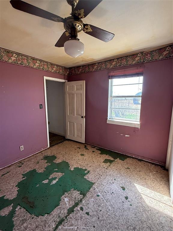 unfurnished bedroom with a ceiling fan