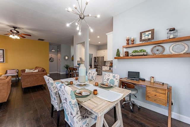 dining area with hardwood / wood-style flooring, ceiling fan with notable chandelier, visible vents, and baseboards