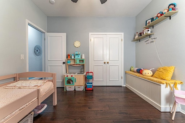 bedroom with a closet, ceiling fan, and wood finished floors