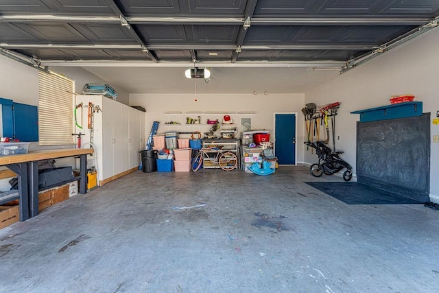 garage featuring a workshop area and a garage door opener