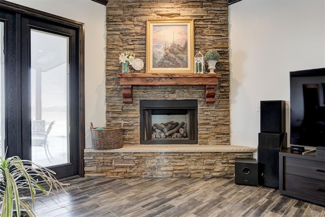 living room with a fireplace and wood finished floors