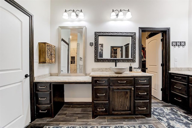 bathroom featuring vanity and wood finished floors