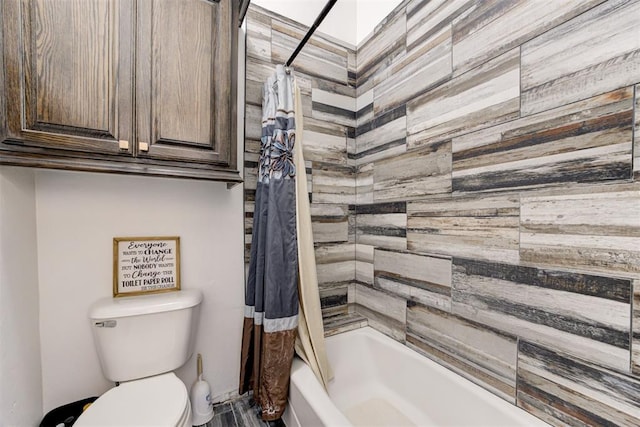 full bath with shower / bath combo with shower curtain and toilet
