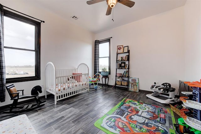 bedroom featuring wood finished floors and a ceiling fan