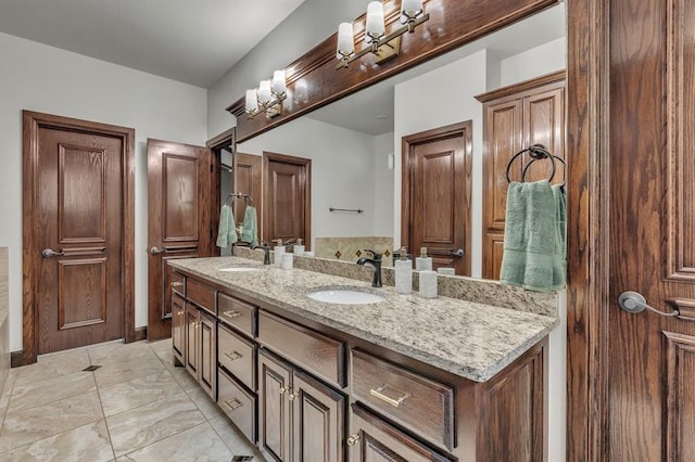 bathroom featuring double vanity and a sink