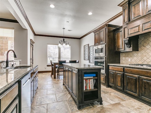 kitchen featuring dark stone countertops, a sink, stone tile flooring, appliances with stainless steel finishes, and backsplash