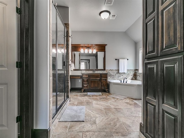 full bathroom featuring visible vents, stone finish flooring, a stall shower, a bath, and vanity