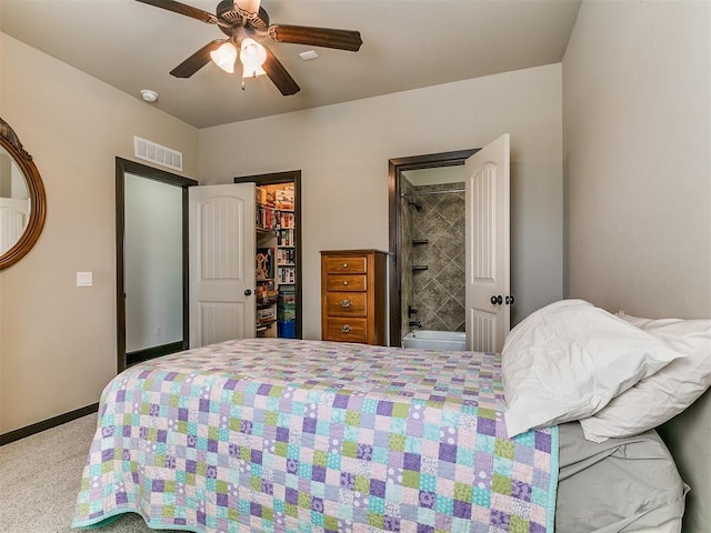 bedroom featuring visible vents, a closet, baseboards, ceiling fan, and a spacious closet