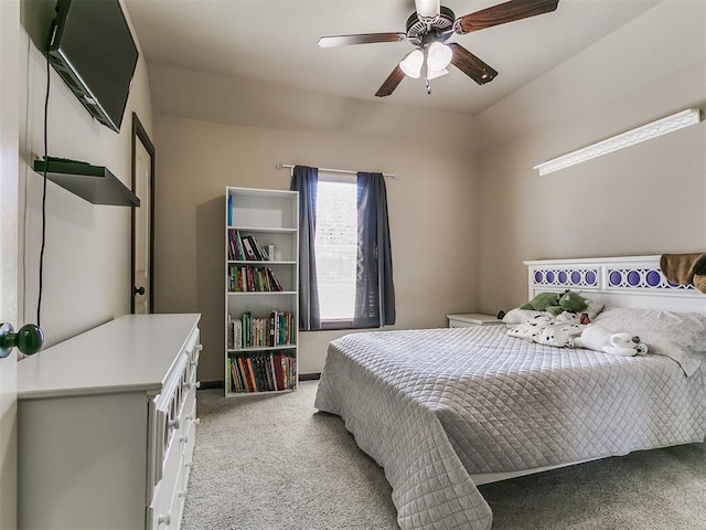 bedroom with ceiling fan and light carpet