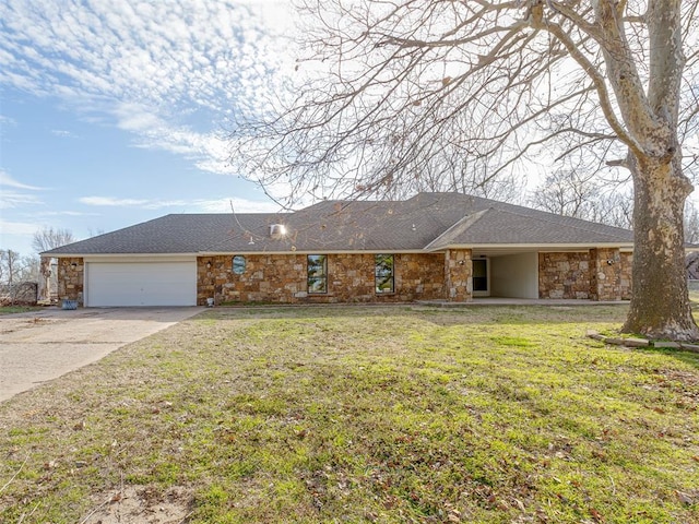 ranch-style home with concrete driveway, a front yard, roof with shingles, stone siding, and an attached garage