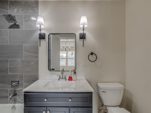 bathroom featuring toilet and vanity