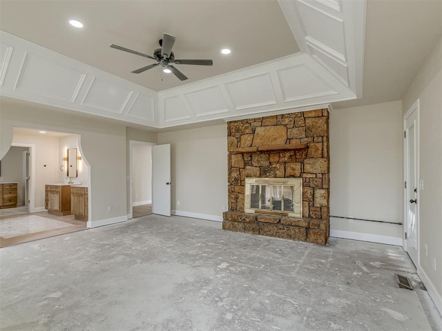 unfurnished living room featuring baseboards, visible vents, a fireplace, recessed lighting, and ceiling fan