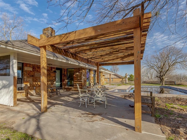 view of patio / terrace with a pergola and an empty pool