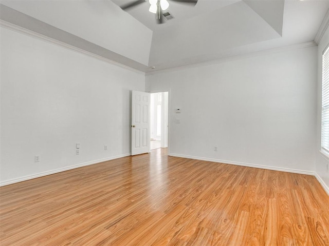 unfurnished room with visible vents, crown molding, a ceiling fan, and light wood finished floors