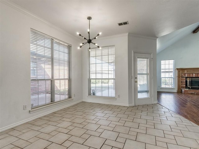 unfurnished dining area with a wealth of natural light, visible vents, a chandelier, and ornamental molding