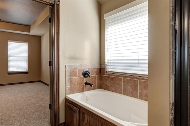 bathroom with a garden tub