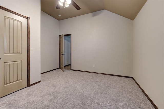 unfurnished bedroom with baseboards, light carpet, a ceiling fan, and vaulted ceiling