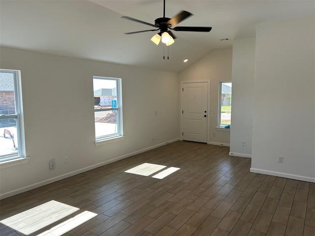 2948 NW 196th Pl, Edmond, OK 73012 - unfurnished room with plenty of natural light, wood finished floors, vaulted ceiling, and baseboards