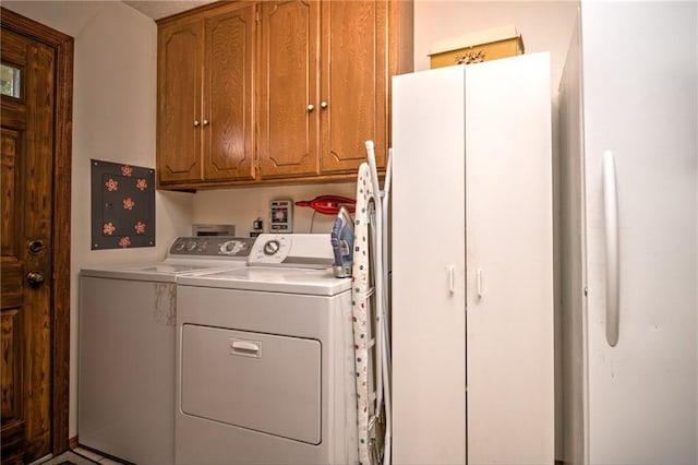 laundry area featuring washer and dryer and cabinet space