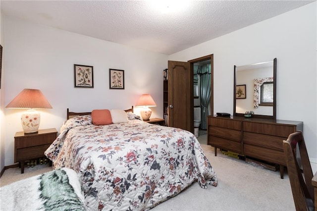 bedroom with light colored carpet and a textured ceiling