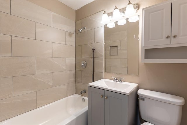 bathroom with toilet, vanity, and bathtub / shower combination