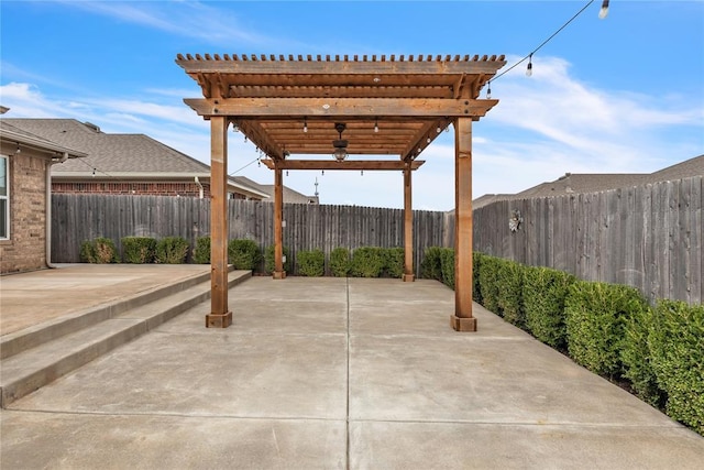 view of patio featuring a fenced backyard, a pergola, and ceiling fan